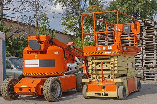 pallets being moved by forklift in a warehouse setting in Danbury, TX